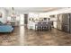 Spacious kitchen with white cabinetry, stainless steel appliances, granite countertops, and hardwood floors at 694 N Sobota Way, Trafalgar, IN 46181