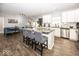 Modern kitchen with white cabinets, granite countertops, stainless steel appliances, and hardwood floors at 694 N Sobota Way, Trafalgar, IN 46181