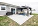 Back patio with a modern gazebo, comfortable seating, and outdoor grill, perfect for entertaining at 694 N Sobota Way, Trafalgar, IN 46181