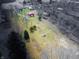 Aerial view of a property showing the expansive lot with lush green space and a barn at 7212 E Rocklane Rd, Needham, IN 46162