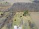 Aerial view of the property displaying a expansive lot with areas of grass and areas of trees at 7212 E Rocklane Rd, Needham, IN 46162