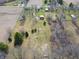Aerial view of a property showing the expansive lot with lush green space and a barn at 7212 E Rocklane Rd, Needham, IN 46162