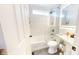 Updated bathroom featuring tiled shower over tub, vanity, and modern fixtures at 7212 E Rocklane Rd, Needham, IN 46162