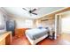 Bedroom with hardwood floors, wood wall, a window and ceiling fan at 7212 E Rocklane Rd, Needham, IN 46162
