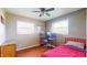 This bedroom is well lit with hardwood floors and multiple windows at 7212 E Rocklane Rd, Needham, IN 46162