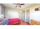 This bedroom features hardwood floors and a ceiling fan for ultimate comfort at 7212 E Rocklane Rd, Needham, IN 46162