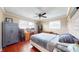 Bedroom with hardwood floors, multiple windows and ceiling fan at 7212 E Rocklane Rd, Needham, IN 46162