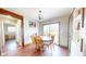 Dining room featuring wood table and chairs, wood floors, and natural light through sliding glass doors at 7212 E Rocklane Rd, Needham, IN 46162