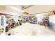 Spacious garage with ample storage space, work area, and overhead lighting at 7212 E Rocklane Rd, Needham, IN 46162