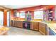 Well-lit kitchen featuring custom wood countertops and modern appliances at 7212 E Rocklane Rd, Needham, IN 46162