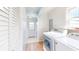 Bright laundry room features white appliances and a convenient layout at 7212 E Rocklane Rd, Needham, IN 46162