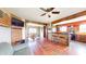 Open living room features wood beams and flooring and a dining room in the background at 7212 E Rocklane Rd, Needham, IN 46162