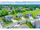 High-angle shot features an expansive neighborhood with lush green trees, well-kept lawns, and Gathering homes at 7251 Birch Leaf Dr, Indianapolis, IN 46259