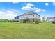 Expansive backyard featuring lush green lawn, patio, and well-manicured landscaping, perfect for outdoor living at 7251 Birch Leaf Dr, Indianapolis, IN 46259