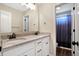 Bathroom featuring double sinks, a granite countertop, white cabinets, and new hard wood floors at 7251 Birch Leaf Dr, Indianapolis, IN 46259
