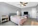 Bedroom featuring neutral walls, carpeted floors, a ceiling fan, and two bedside tables at 7251 Birch Leaf Dr, Indianapolis, IN 46259