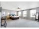 Large main bedroom featuring stylish decor, ceiling fan, and two bright windows at 7251 Birch Leaf Dr, Indianapolis, IN 46259