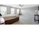 Large main bedroom with ceiling fan, three windows, and designer-chosen decor at 7251 Birch Leaf Dr, Indianapolis, IN 46259