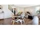 Charming dining area featuring a round wooden table with seating and a staircase in the background at 7251 Birch Leaf Dr, Indianapolis, IN 46259