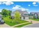 Beautiful two-story home with three-car garage, well-maintained lawn, and attractive landscaping at 7251 Birch Leaf Dr, Indianapolis, IN 46259