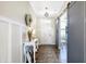 Inviting foyer with wood floors, white wainscoting and charming decorative accents at 7251 Birch Leaf Dr, Indianapolis, IN 46259