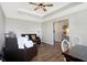 Cozy living room featuring wood floors, tray ceilings and comfortable, neutral furnishings at 7251 Birch Leaf Dr, Indianapolis, IN 46259