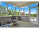 Inviting screened-in porch with stylish seating and peaceful outdoor views at 7251 Birch Leaf Dr, Indianapolis, IN 46259