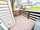A wooden back deck overlooking the water offers a tranquil outdoor space at 8030 Windham Lake Way, Indianapolis, IN 46214