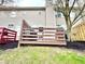 A well-maintained backyard with a wooden deck offers a perfect blend of relaxation and entertainment at 8030 Windham Lake Way, Indianapolis, IN 46214
