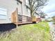 Well-maintained yard with a wooden deck that backs to the water at 8030 Windham Lake Way, Indianapolis, IN 46214