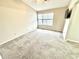 Carpeted bedroom with large window offering lots of natural light at 8030 Windham Lake Way, Indianapolis, IN 46214