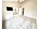 Spacious carpeted bedroom with ensuite bath and wall-mounted TV at 8030 Windham Lake Way, Indianapolis, IN 46214