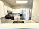 Bright kitchen featuring white cabinets, stainless steel appliances, and granite countertops at 8030 Windham Lake Way, Indianapolis, IN 46214