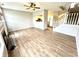 Spacious living room featuring wood floors, a fireplace, and an open concept design at 8030 Windham Lake Way, Indianapolis, IN 46214