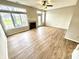 Well-lit living room with fireplace, wood floors, and access to outdoor space at 8030 Windham Lake Way, Indianapolis, IN 46214