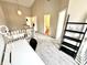 Loft area with neutral carpet, natural light, leading to bathroom and other rooms at 8030 Windham Lake Way, Indianapolis, IN 46214