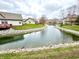 Tranquil water view showcasing the lush greenery and serene ambiance of the community at 8030 Windham Lake Way, Indianapolis, IN 46214