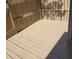 The backyard features a painted wooden fence and back deck, great for relaxing outdoors at 8345 Paso Del Norte Ct, Indianapolis, IN 46227