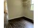 Well-lit room showcasing hardwood flooring and built-in shelving at 8345 Paso Del Norte Ct, Indianapolis, IN 46227