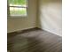 Cozy bedroom featuring a large window with plenty of natural light and hardwood flooring at 8345 Paso Del Norte Ct, Indianapolis, IN 46227