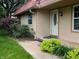 Charming home featuring a front entrance surrounded by lush green landscaping at 8345 Paso Del Norte Ct, Indianapolis, IN 46227