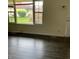 Bright living room featuring expansive windows and contemporary flooring at 8345 Paso Del Norte Ct, Indianapolis, IN 46227