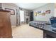 This bedroom features a checkered bedspread, carpeted floor, painted walls, and decor with a car theme at 839 Bough St, Whiteland, IN 46184