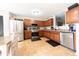 Well-equipped kitchen featuring stainless steel appliances and wood cabinets at 839 Bough St, Whiteland, IN 46184