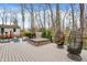 Enjoy this backyard deck with egg chairs, a hot tub, and access to wooded surroundings at 8990 Pickwick Dr, Indianapolis, IN 46260