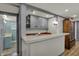 Well-equipped bar area with sink, cabinets, and convenient access to the adjacent bathroom at 8990 Pickwick Dr, Indianapolis, IN 46260
