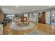 Finished basement offering living area with a dining table and chairs, great for entertaining at 8990 Pickwick Dr, Indianapolis, IN 46260