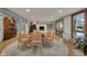 Finished basement offers a dining area and fireplace, complemented by natural light and modern fixtures at 8990 Pickwick Dr, Indianapolis, IN 46260