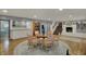 Finished basement featuring a dining area and a wet bar with a staircase leading upstairs at 8990 Pickwick Dr, Indianapolis, IN 46260