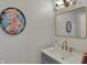 Stylish powder room features elegant vanity, modern fixtures, and tasteful decor at 8990 Pickwick Dr, Indianapolis, IN 46260